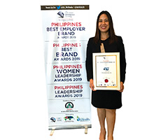 Woman with 'Best Employers' certificate of the Employer Branding Institute (EBI) in the Philippines