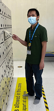 Man standing in front of lockers