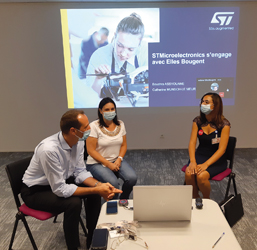 Three people in front of a presentation  (photo)